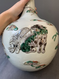 A pair of Chinese famille verte relief-decorated 'animals' vases, 19th C.