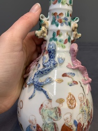 A pair of Chinese famille rose '18 Luohan' bottle vases, 19th C.