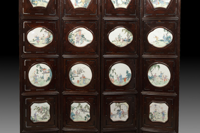 A Chinese four-fold wooden room divider with famille rose 'Romance of the Western Chamber' plaques, Republic