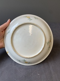 A Chinese wucai shipwreck plate with figures in a landscape, Wanli