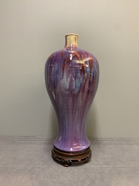 A Chinese flamb&eacute;-glazed 'meiping' vase on wooden stand, 18/19th C.