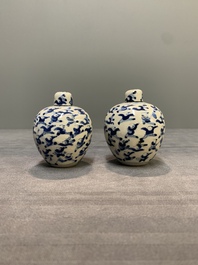 A pair of Chinese blue and white soft paste '100 boys' covered jarlets and a seal paste box, Kangxi mark, 19th C.