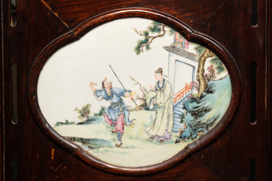A Chinese four-fold wooden room divider with famille rose 'Romance of the Western Chamber' plaques, Republic