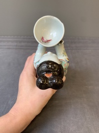 A Chinese famille rose figure of a lady presenting a bowl, Qianlong
