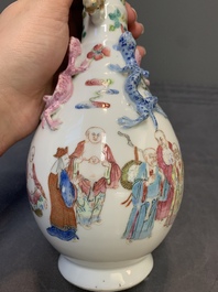 A pair of Chinese famille rose '18 Luohan' bottle vases, 19th C.