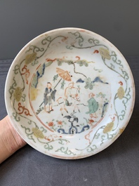 A Chinese wucai shipwreck plate with figures in a landscape, Wanli