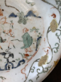 A Chinese wucai shipwreck plate with figures in a landscape, Wanli
