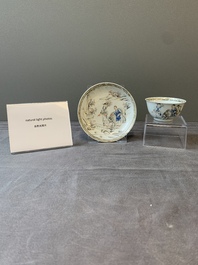 A Chinese blue-enamelled gilt-decorated grisaille cup and saucer, Yongzheng