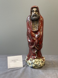A Chinese Shiwan flamb&eacute;-glazed figure of a Luohan, Deng 邓 seal mark, dated 1927