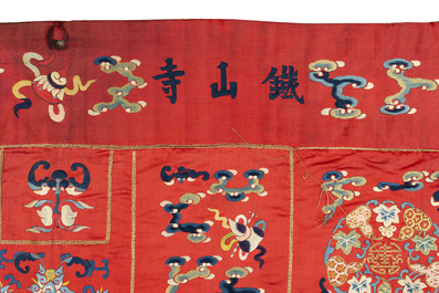 A Chinese red-ground embroidered silk 'bajixiang' panel, Tie Shan Si 鐵山寺 mark, 19th C.