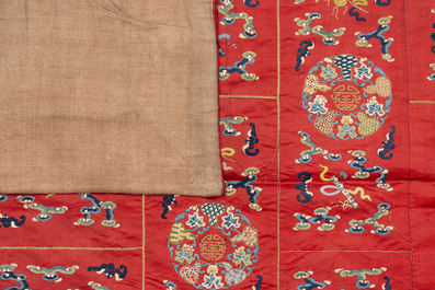 A Chinese red-ground embroidered silk 'bajixiang' panel, Tie Shan Si 鐵山寺 mark, 19th C.