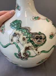 A pair of Chinese famille verte relief-decorated 'animals' vases, 19th C.