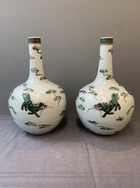 A pair of Chinese famille verte relief-decorated 'animals' vases, 19th C.