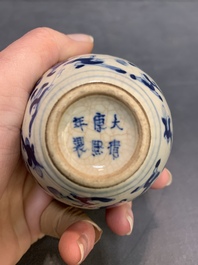 A pair of Chinese blue and white soft paste '100 boys' covered jarlets and a seal paste box, Kangxi mark, 19th C.
