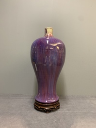 A Chinese flamb&eacute;-glazed 'meiping' vase on wooden stand, 18/19th C.