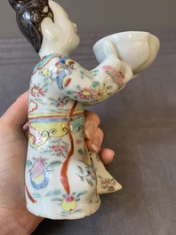 A Chinese famille rose figure of a lady presenting a bowl, Qianlong