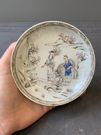 A Chinese blue-enamelled gilt-decorated grisaille cup and saucer, Yongzheng