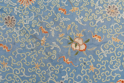 A Chinese blue-ground embroidered silk panel with a dragon among bajixiang, 19th C.