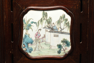 A Chinese four-fold wooden room divider with famille rose 'Romance of the Western Chamber' plaques, Republic
