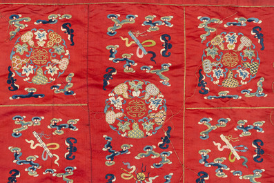A Chinese red-ground embroidered silk 'bajixiang' panel, Tie Shan Si 鐵山寺 mark, 19th C.