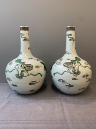 A pair of Chinese famille verte relief-decorated 'animals' vases, 19th C.