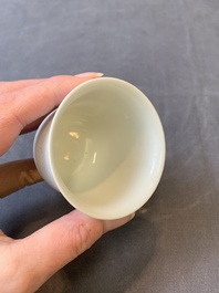 A Chinese white-glazed biscuit 'dragon' cup, Kangxi mark, 19th C.