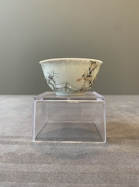 A Chinese blue-enamelled gilt-decorated grisaille cup and saucer, Yongzheng