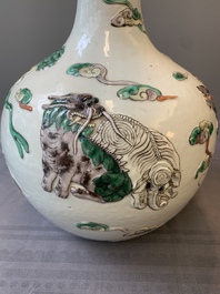 A pair of Chinese famille verte relief-decorated 'animals' vases, 19th C.
