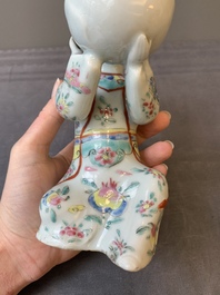 A Chinese famille rose figure of a lady presenting a bowl, Qianlong