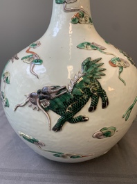 A pair of Chinese famille verte relief-decorated 'animals' vases, 19th C.
