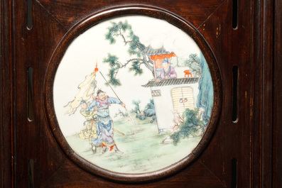 A Chinese four-fold wooden room divider with famille rose 'Romance of the Western Chamber' plaques, Republic