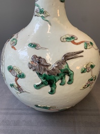 A pair of Chinese famille verte relief-decorated 'animals' vases, 19th C.