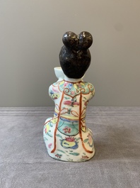 A Chinese famille rose figure of a lady presenting a bowl, Qianlong