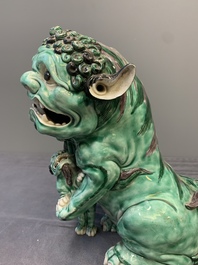 A Chinese verte biscuit group of a Buddhist lion with cub, 19th C.