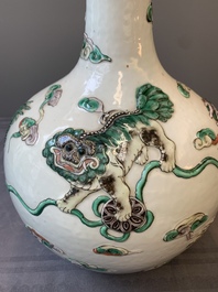 A pair of Chinese famille verte relief-decorated 'animals' vases, 19th C.