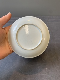 A Chinese blue-enamelled gilt-decorated grisaille cup and saucer, Yongzheng