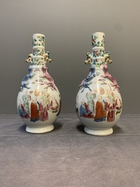 A pair of Chinese famille rose '18 Luohan' bottle vases, 19th C.