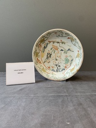 A Chinese wucai shipwreck plate with figures in a landscape, Wanli