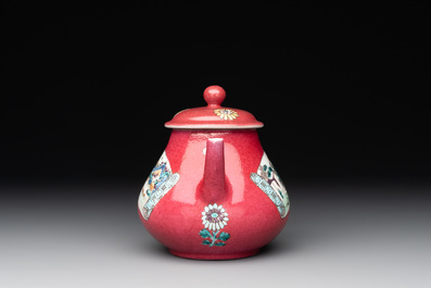 A Chinese famille rose ruby-ground 'landscape scroll' teapot, Yongzheng