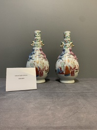 A pair of Chinese famille rose '18 Luohan' bottle vases, 19th C.