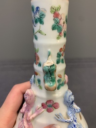A pair of Chinese famille rose '18 Luohan' bottle vases, 19th C.