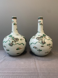 A pair of Chinese famille verte relief-decorated 'animals' vases, 19th C.
