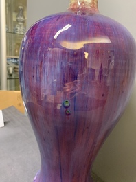 A Chinese flamb&eacute;-glazed 'meiping' vase on wooden stand, 18/19th C.