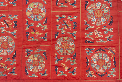 A Chinese red-ground embroidered silk 'bajixiang' panel, Tie Shan Si 鐵山寺 mark, 19th C.
