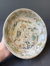 A Chinese wucai shipwreck plate with figures in a landscape, Wanli