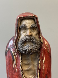A Chinese Shiwan flamb&eacute;-glazed figure of a Luohan, Deng 邓 seal mark, dated 1927