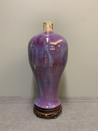 A Chinese flamb&eacute;-glazed 'meiping' vase on wooden stand, 18/19th C.