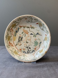 A Chinese wucai shipwreck plate with figures in a landscape, Wanli