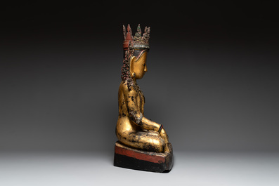 A very large Burmese mica-inlaid gilt-lacquered wooden Buddha, 19th C.