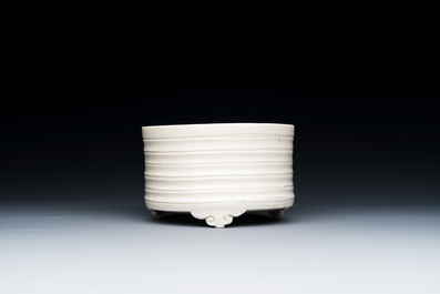 A Chinese Dehua blanc de Chine tripod censer, Kangxi